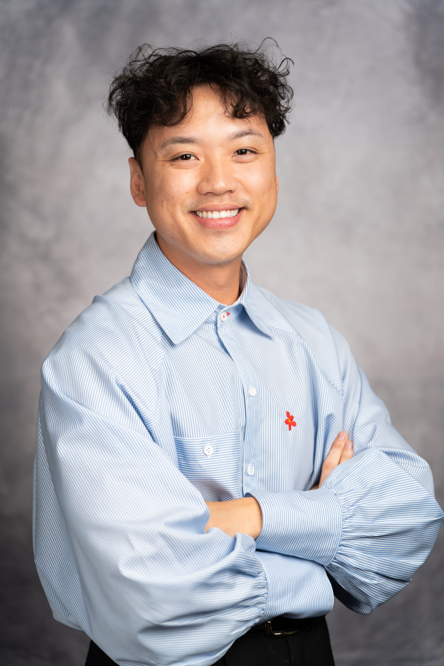 Michelle O'Connor, doctor at Mansfield Pediatrics, PLLC, wearing a black shirt with a growing child on it.